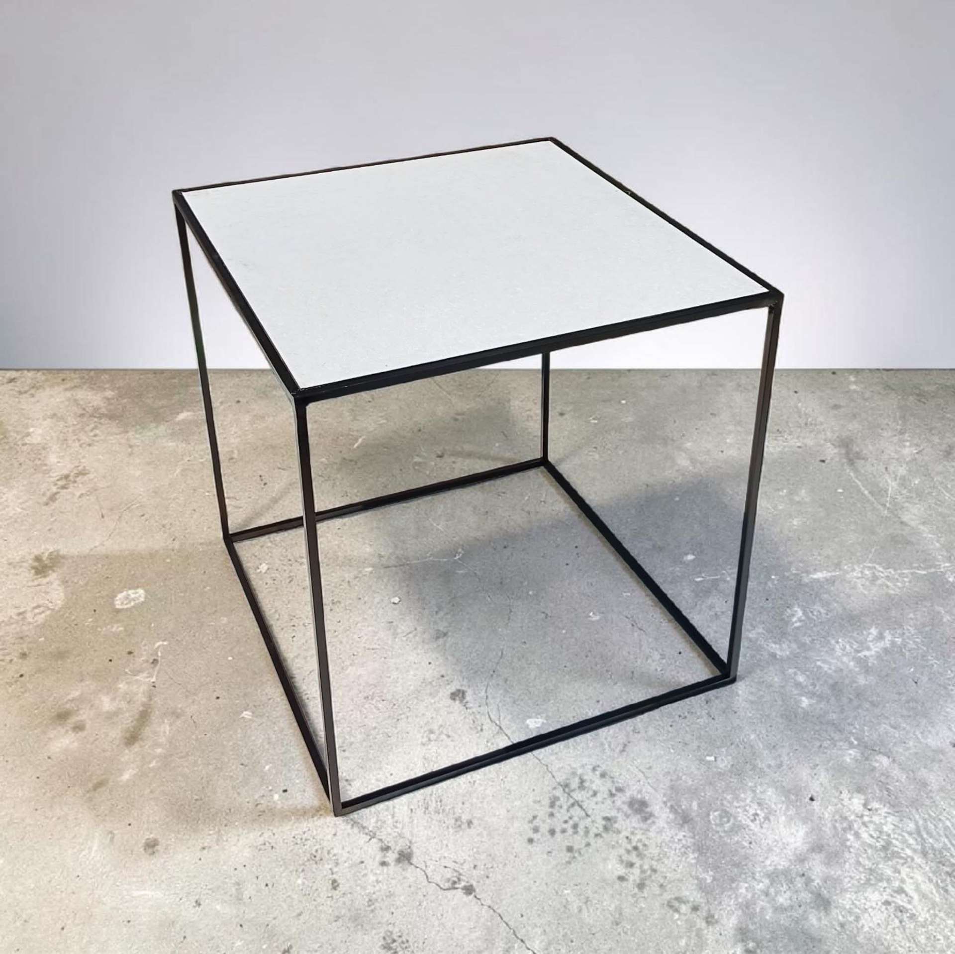 Minimal black steel cube side table with a light inset top
