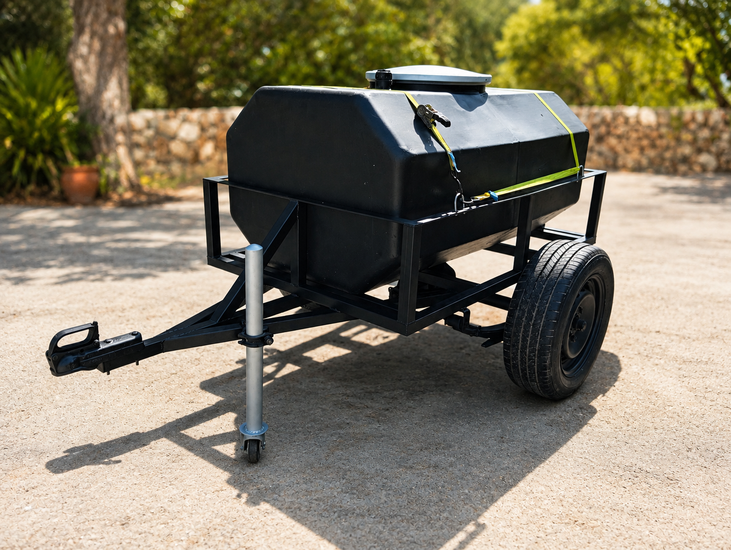 Custom water tank trailer with black mild-steel frame and single axle